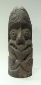 A late 19th/early 20th Century Polynesian carved hard wood Tiki post head with tattooed face