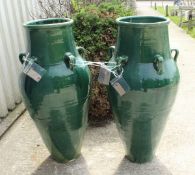 A pair of green glazed Sharab wine vessels