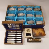 A vintage Mappin & Webb cardboard box containing twelve plated half tankards inscribed with the