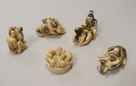 A collection of 20th Century Japanese Shunga mammoth ivory okimono including five figures in a