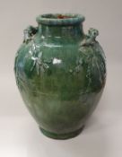 A 19th Century Chinese mottled green glazed vase with relief work bamboo decoration and handles