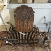 A cast iron fire back of small proportions depicting figure to centre,