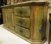 An Indian painted hardwood dresser with all-over panel decoration of floral sprays,