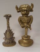 A Victorian brass pineapple doorstop and another as an imp or mythical horned beast