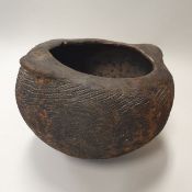 A West African textured terracotta pot with lug handles