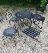 A painted metal garden table together with two folding bistro style chairs and three further chairs