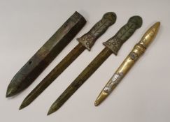 A collection of items comprising a jade dagger,
