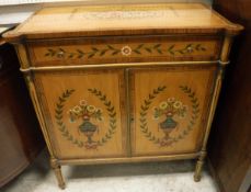 A 20th Century painted satinwood side cabinet in the 19th Century Continental manner with single