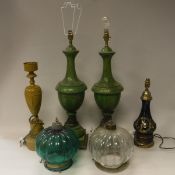 A pair of mottled green painted metal table lamps, a yellow painted Toleware style table lamp,