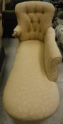 A Victorian button back chaise longue in gold self-patterned upholstery