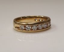 A 14 carat gold half eternity ring set with twelve diamonds, size K/L, over 0.