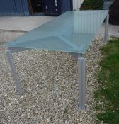 A Bulo H²O glass topped metal framed dining table designed by Claire Bataille and Paul Ibens,