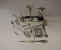 A collection of silverwares to include spill vase, small twin handled trophy cup,