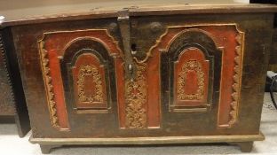 A hardwood coffer with iron mounts and carved and painted front panel in the Oriental manner
