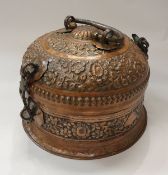 A Middle Eastern (probably Indian) embossed copper floral decorated spice box of large proportions