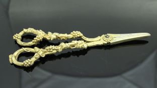 A pair of Victorian silver gilt grape scissors the handles as fruiting vines (by William Theobald &