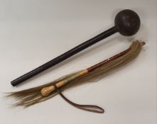 A late 19th/early 20th Century African carved ebony knob kerri and a horsehair fly whisk