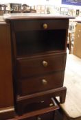 A pair of Stag bedside cupboards together with two matching chests of drawers,