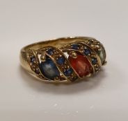 A 9 carat gold stone set dress ring. Ring size P/Q. Total weight 4.