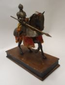 A model of a knight in armour on horseback with lance