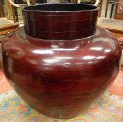 A modern red lacquered Chinese style vase of over-sized proportions