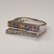 An 18 carat white gold ring set with a row of coloured sapphires and a row of diamonds.