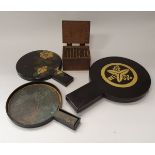 Three Japanese bronze hand mirrors in lacquered cases together with a 48 piece printing block set