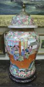 A Chinese famille rose baluster shaped lidded vase converted to a lamp,