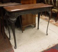 A Victorian cast iron tavern type centre table with swag and bow decoration and mahogany top,