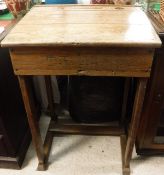 An oak school desk with rising lid