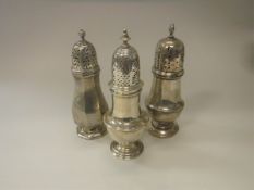 A George VI silver sugar caster of octagonal bellied form,