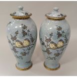 A pair of Carlton ware "Armand" lustre ware vases decorated with birds amongst blossoming branches