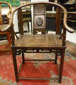 A Chinese rosewood yoke back hall chair, the back panel decorated with lotus flower,