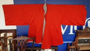 A red silk Chinese jacket with pale blue lining