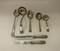 Four Continental white metal serving spoons including sauce ladle and a large plated spoon with