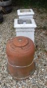A terracotta rhubarb forcer with lid together with a pair of white painted terracotta chimney pots