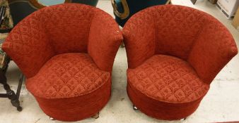 A pair of Victorian tub chairs in red self-patterned upholstery,