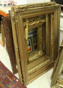 A collection of eight large giltwood and gesso picture frames