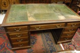 A circa 1900 mahogany double pedestal kneehole desk,