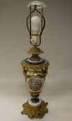 A 19th Century Continental gilt brass and porcelain mounted vase table lamp with classical style