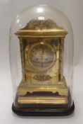 A Victorian lacquered brass cased eight day mantel clock under glass dome