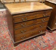 A 19th Century mahogany bachelors chest the plain top above a brushing slide and four long