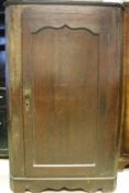 An early 19th Century oak corner cupboard,