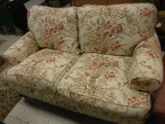 A modern George Smith two seat sofa in the Victorian taste with floral decorated upholstery,