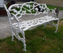 A Coalbrookdale oak leaf and acorn branch design two seat garden bench in the manner of J.