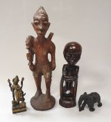 A West African carved wooden figure of a hunter (incomplete),