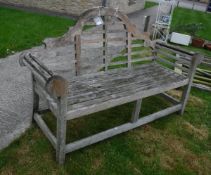 A teak "Lutyens" design garden bench