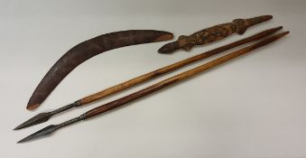 A collection of Aboriginal artefacts to include a late 19th/early 20th Century carved boomerang