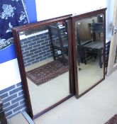 A large mahogany framed and bevelled glass mirror together with a further large mahogany framed