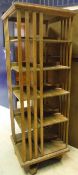 A circa 1900 oak revolving bookcase of five tiers with slatted sides CONDITION REPORTS
